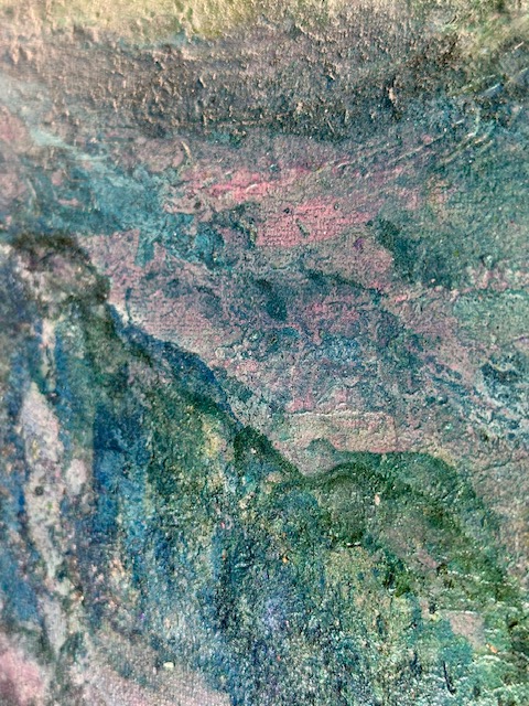 Close-up of verdigris green and rose mineral texture on canvas