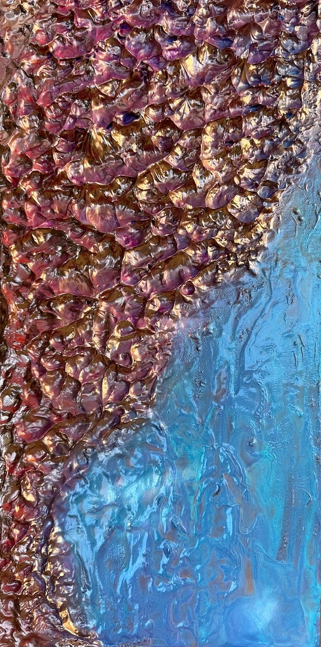 Close-up of amethyst crystalline texture meeting a blue field